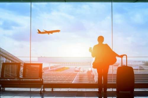 Women watching a flight depart the airport