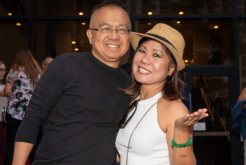 man and woman posing for a photo