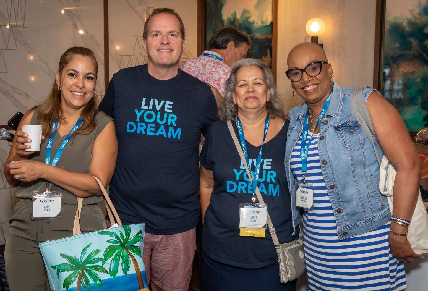 Four Dream Vacations franchisees at a convention