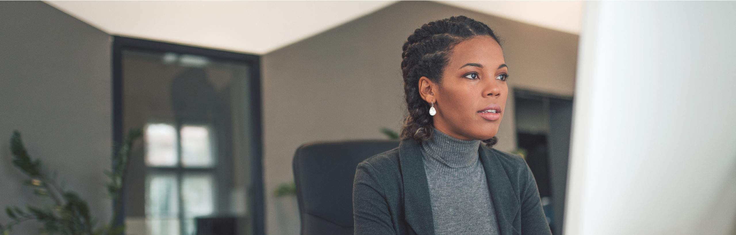 A woman sitting on an office chair