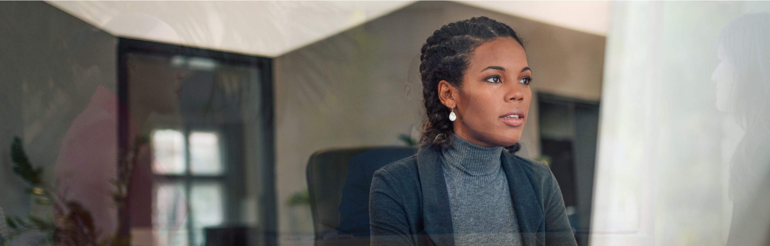 A woman sitting on an office chair