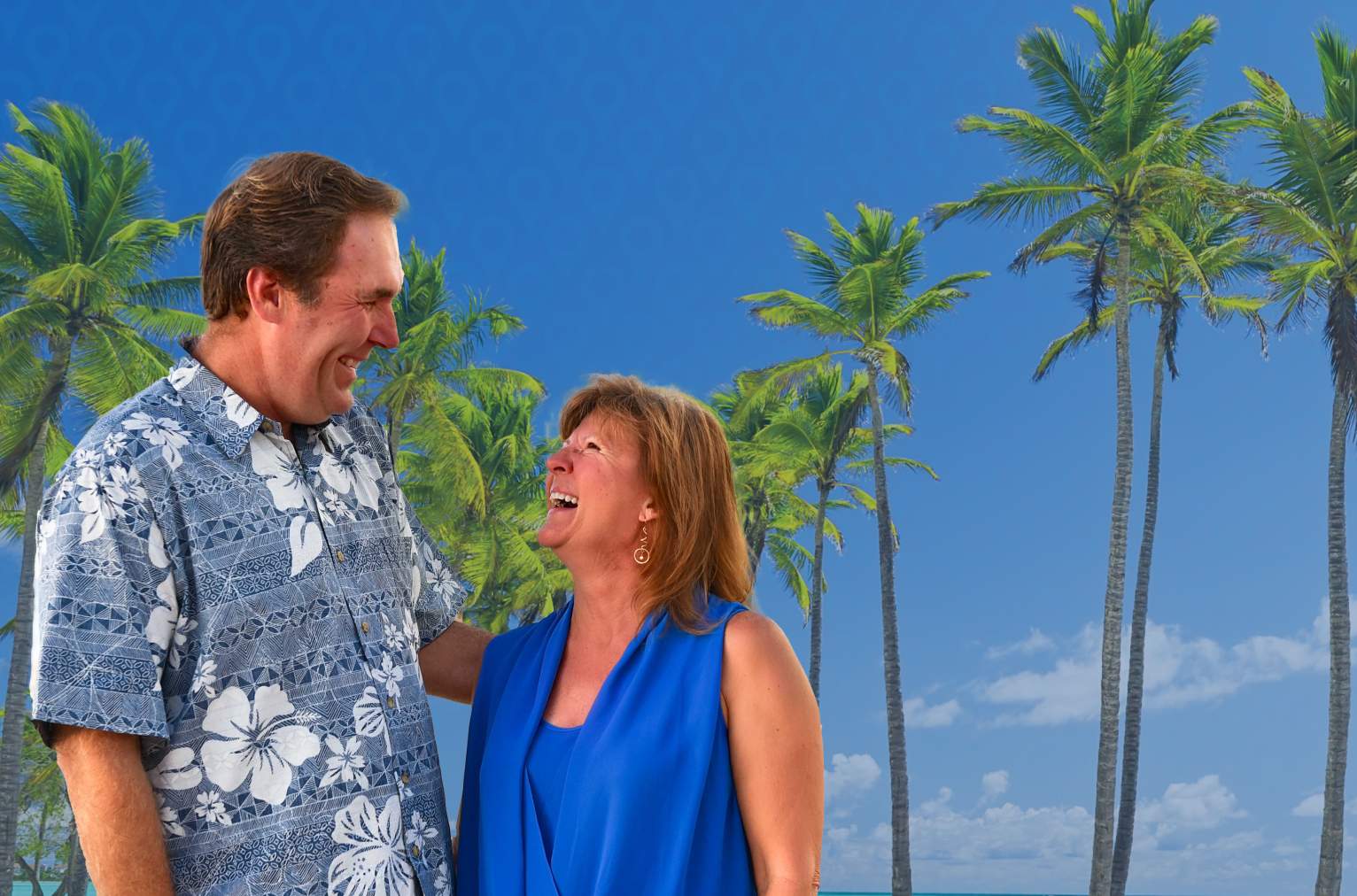 Tablet - A couple on a sunny beach smiling at one another