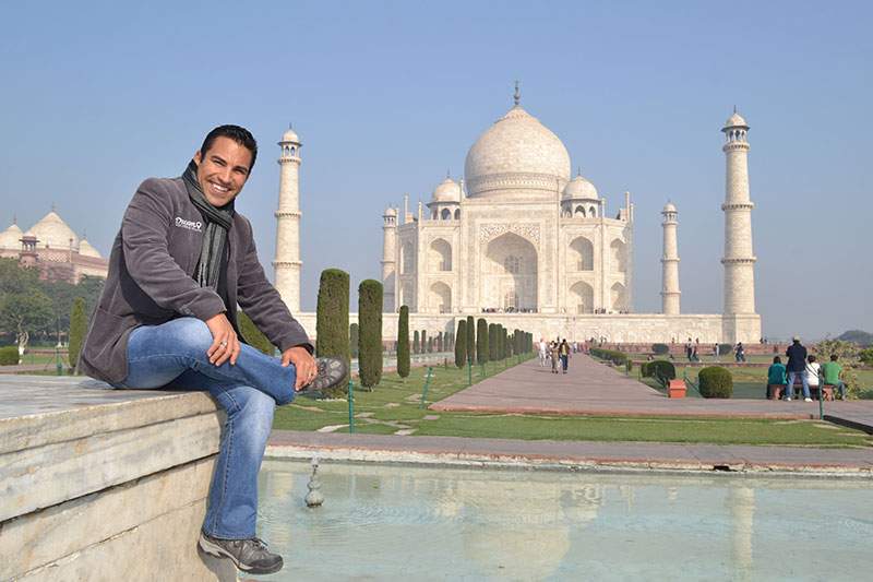 Dream Vacations franchisee posing in front of the Taj Mahal - what do you do as a franchise owner?
