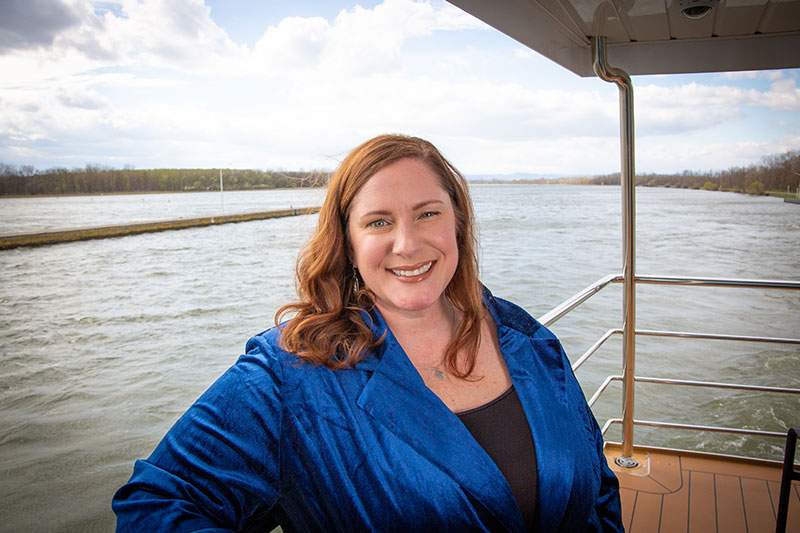 Female travel agent posing on a boat