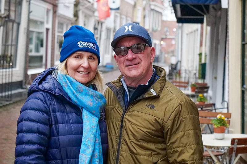 couple bundled up in jackets posing for a photo